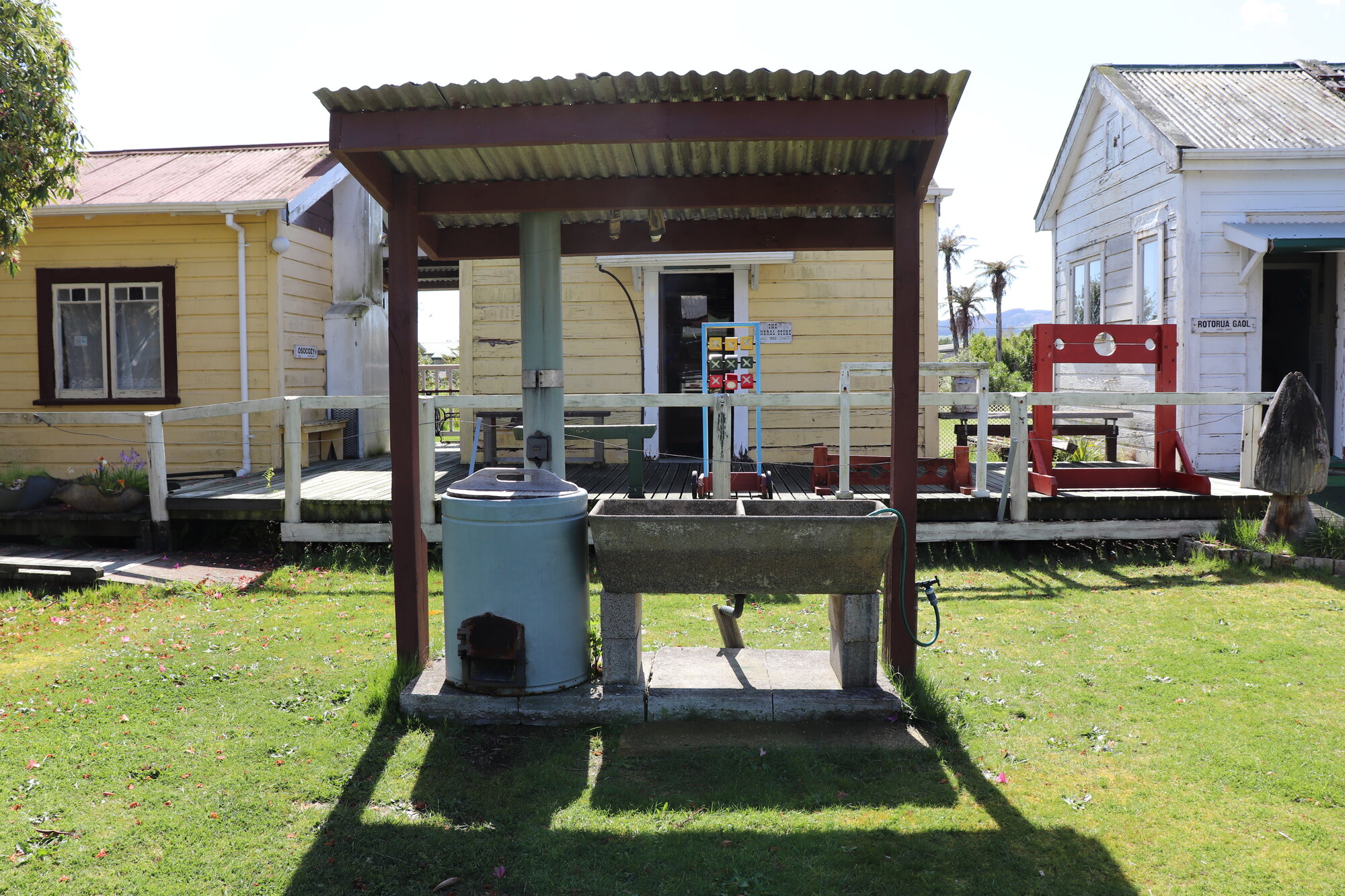 Photograph of the Douslin House gardens with the laundry copper and double sink