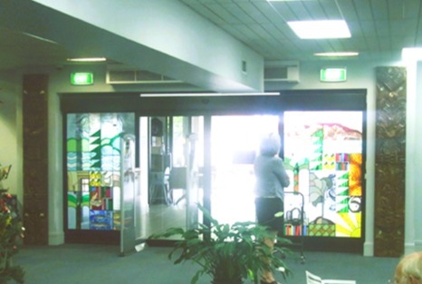 Photograph of the stained-glass panels by John and Jenny Skudder, after being moved to the second floor of Rotorua Library
