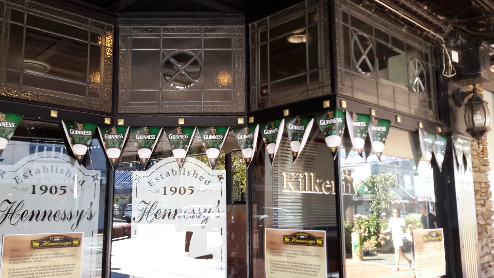 Photograph showing a close up of the stained glass windows of the front of Hennessey's