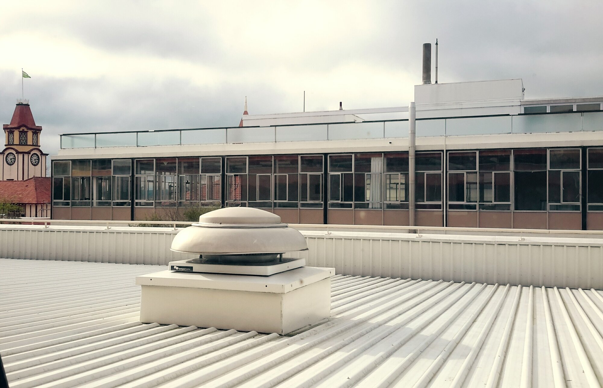 Photograph showing the start of the demolition of Community House top floor