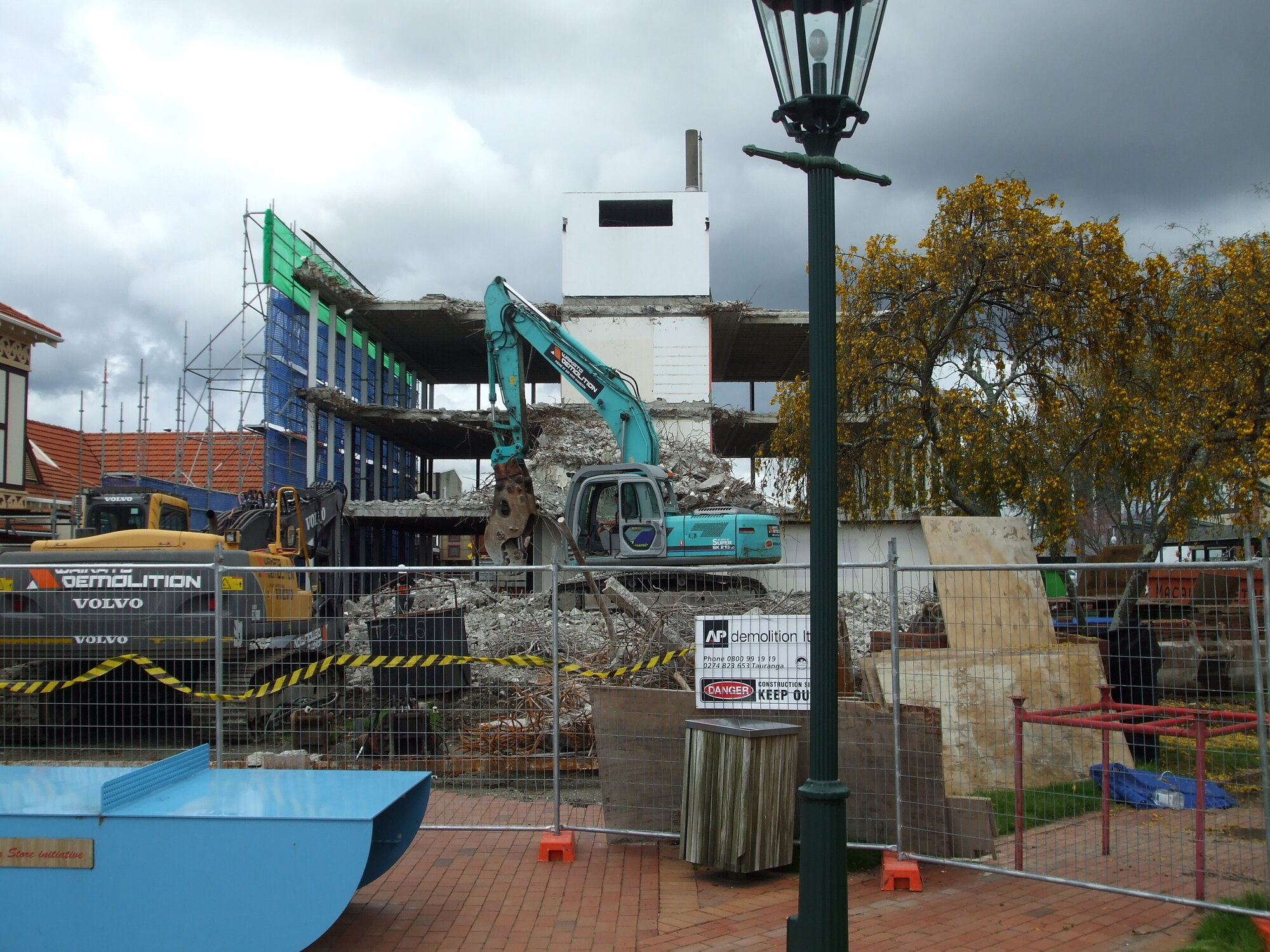 Photograph showing the last bit of the demolition of Community House, the concrete central stairwell
