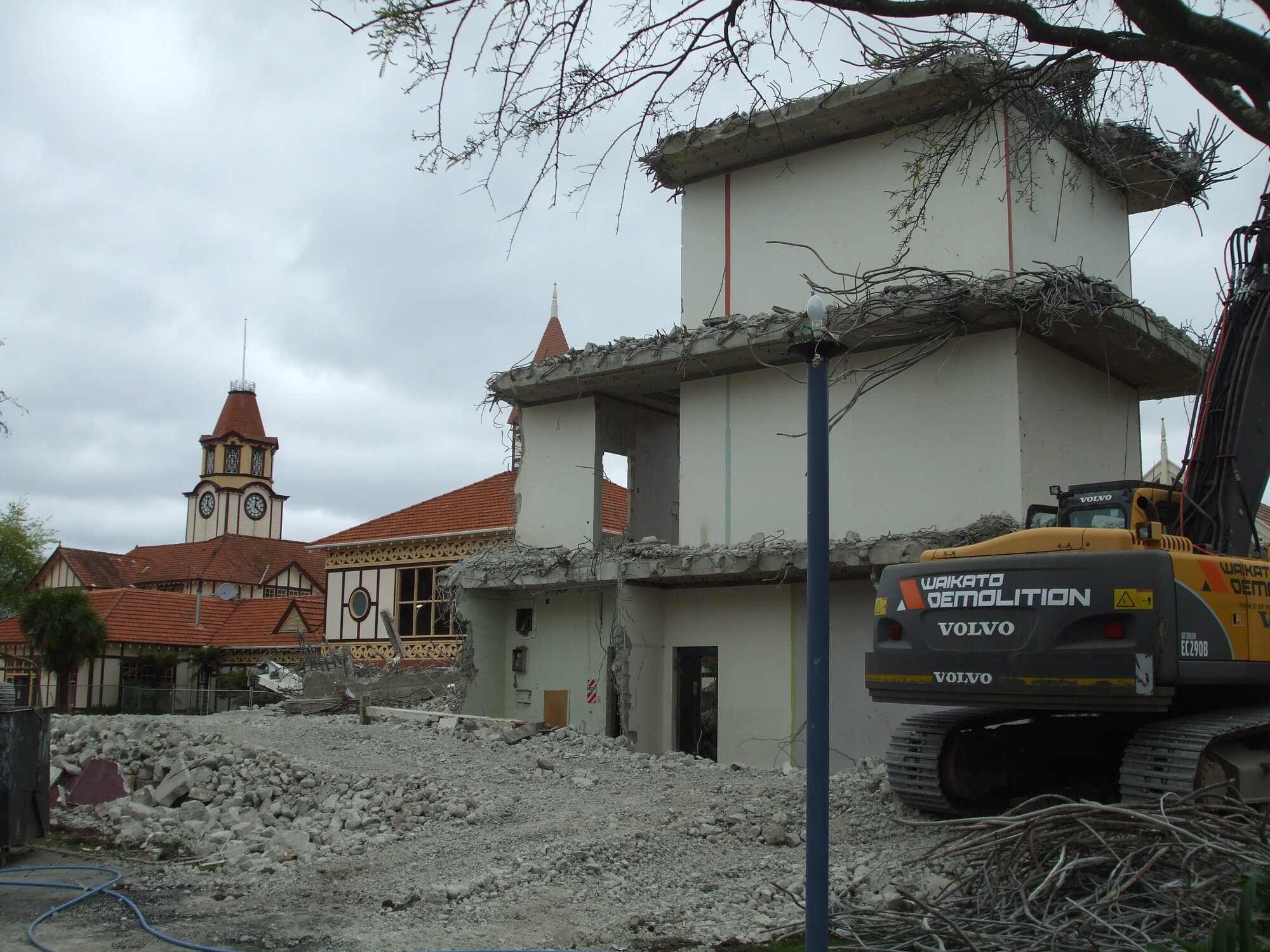 Photograph showing the last bit of the demolition of Community House, the concrete central stairwell