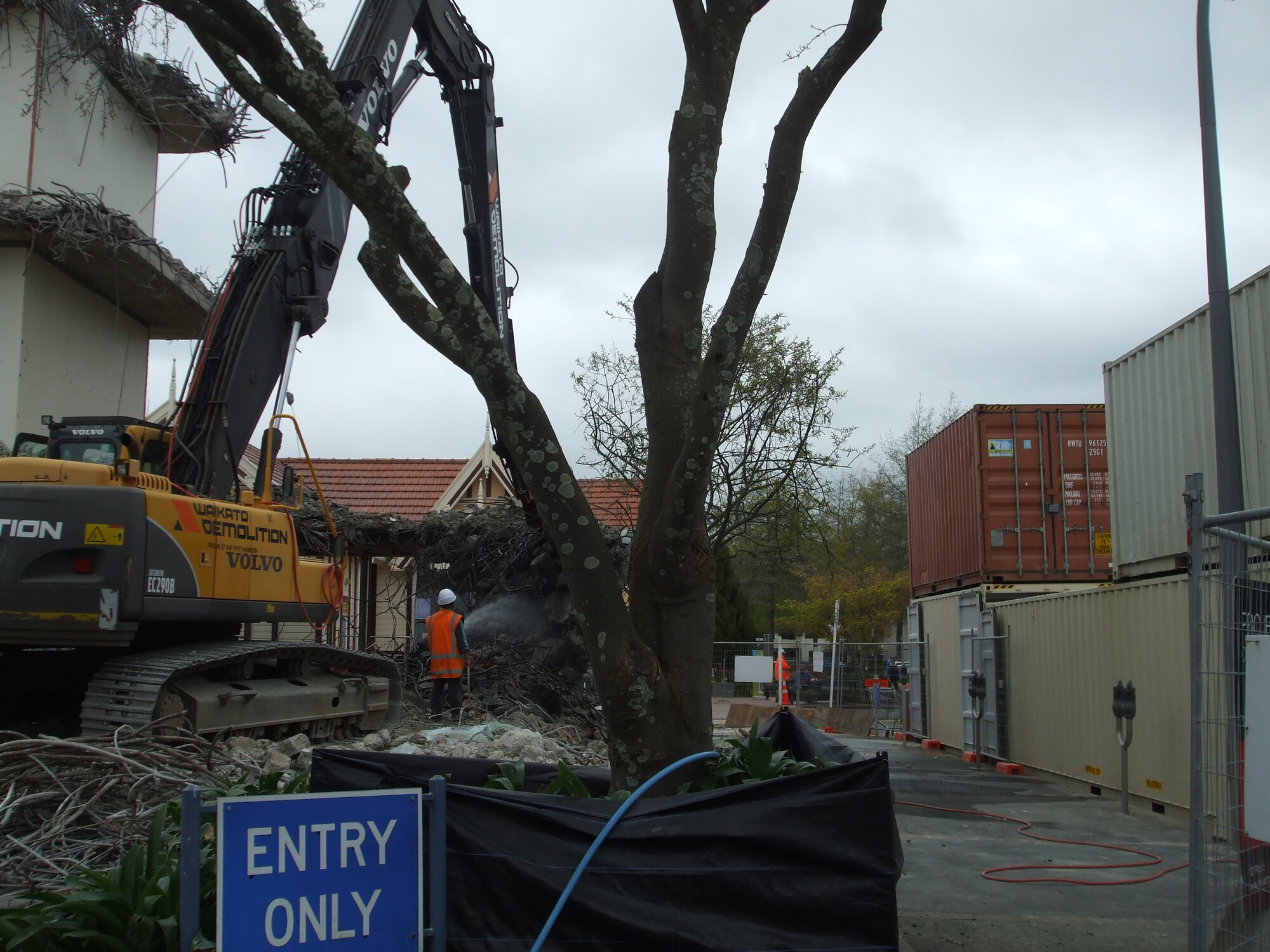 Photograph showing a close up of the crane removing concrete from Community House