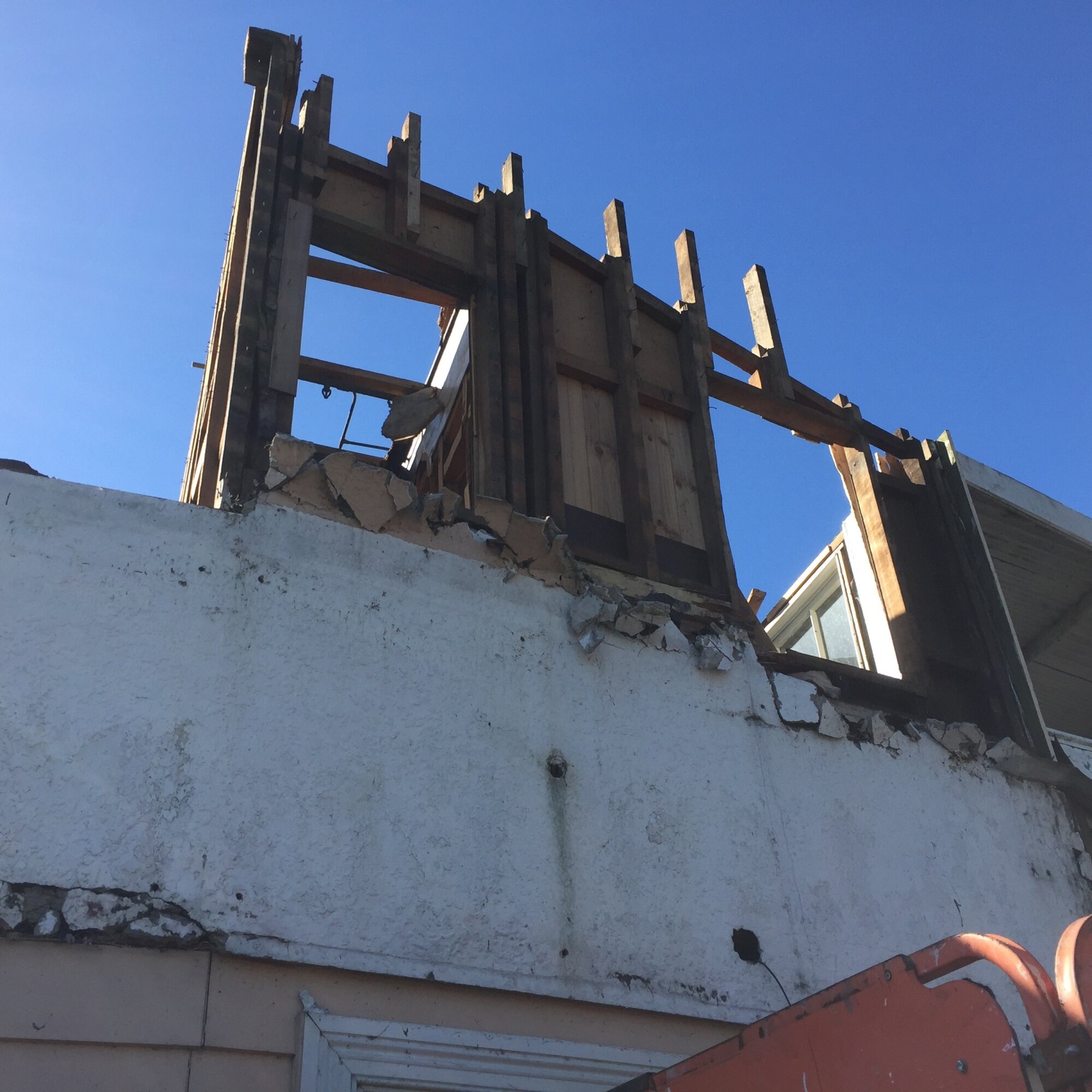Photograph showing the front of the Lake House Hotel with demolition begun
