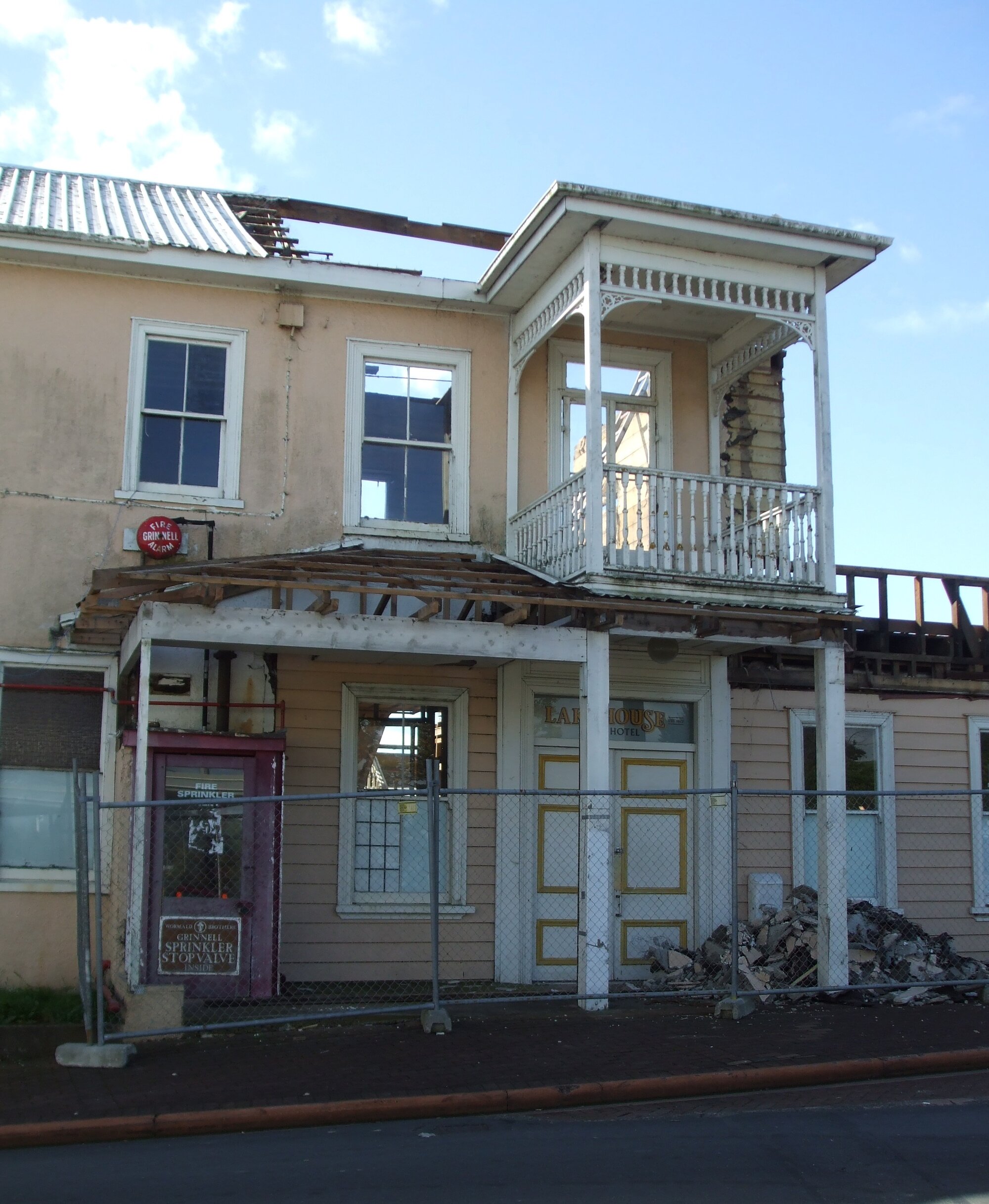 Photograph showing the front of the Lake House Hotel with demolition begun