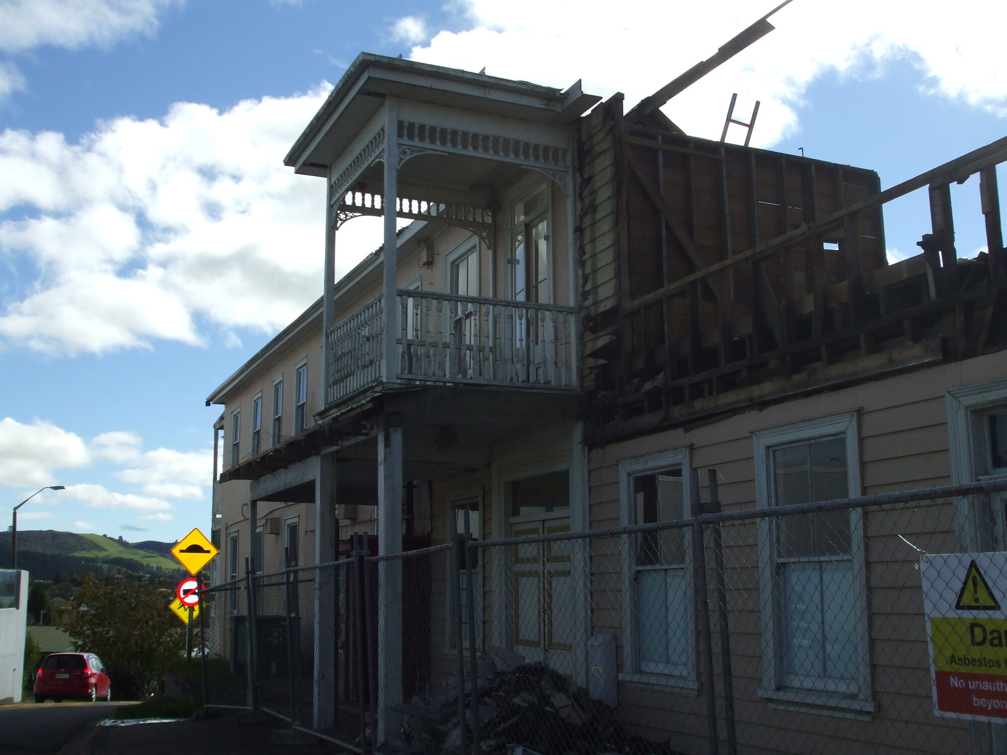 Photograph showing the front of the Lake House Hotel with demolition begun