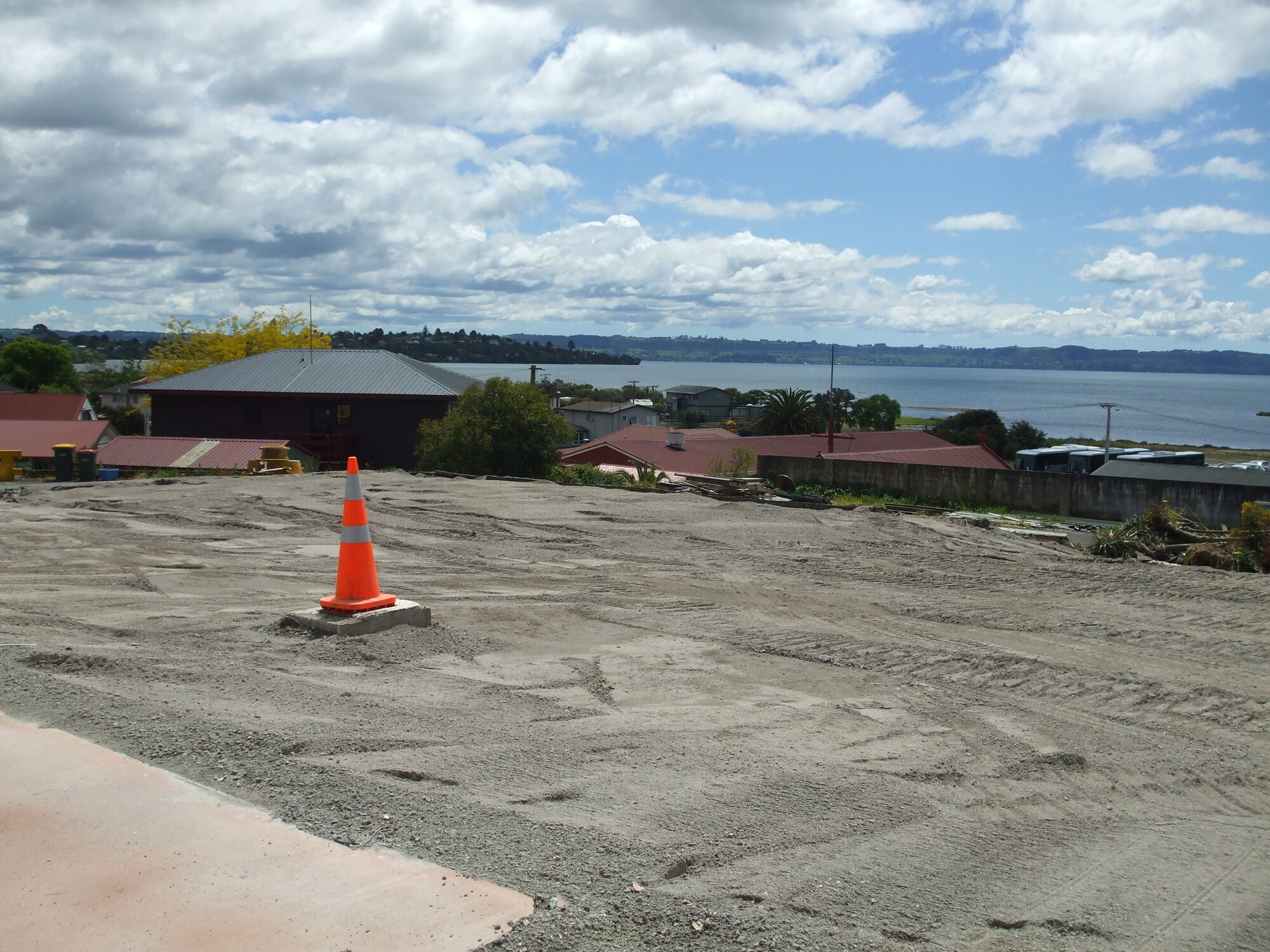 Photograph showing the empty site where the Lake House Hotel stood since 1872