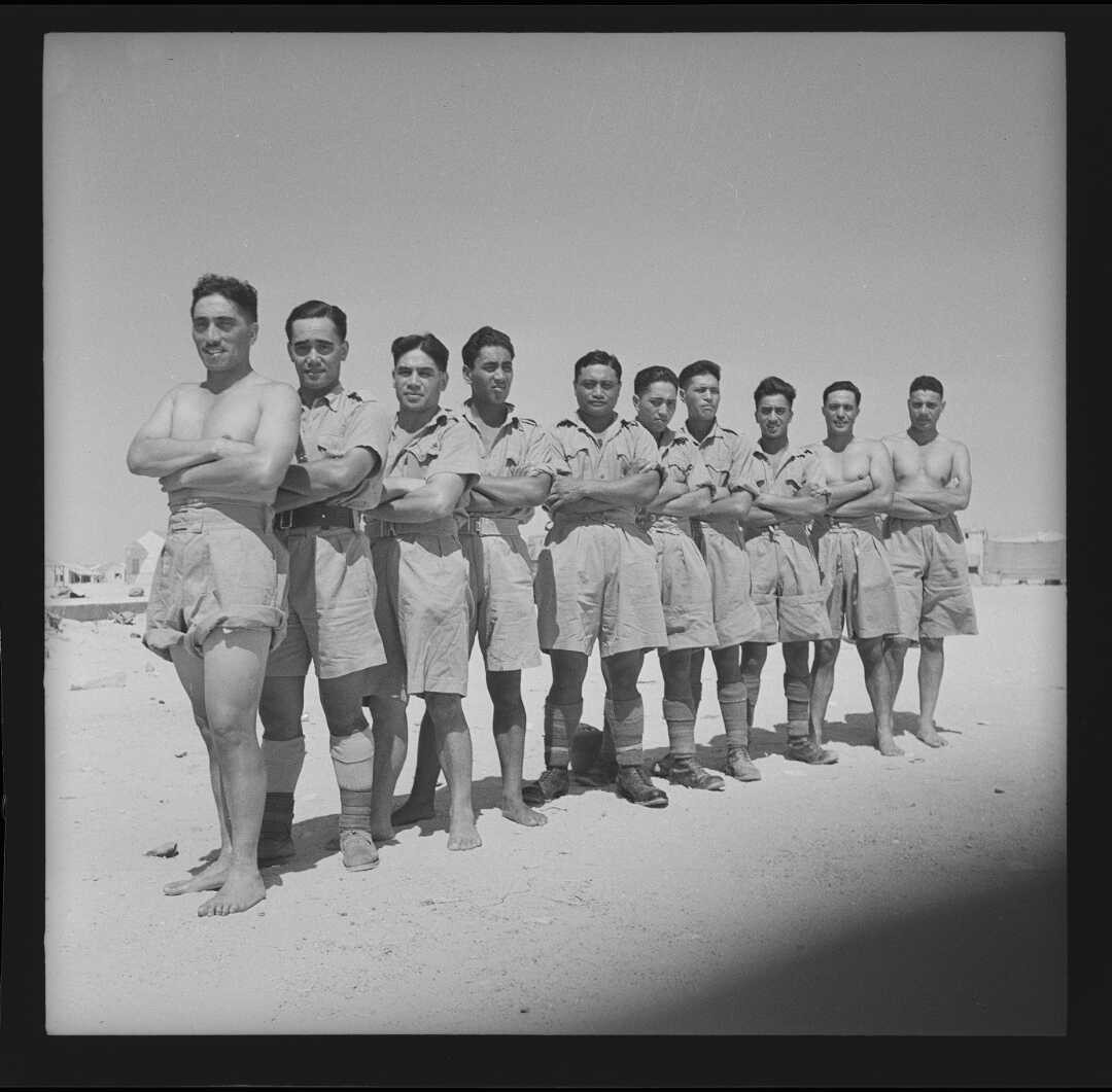 Snapshot 3: Members of the 28th New Zealand (Māori) Battalion at swimming sports in Helwan, Egypt. Ca. Jul 1941. Source: Alexander Turnbull Library (DA-01371-F).

Seven members of the ten-man relay team were from B Company. Left to right: Second Lieutenants Ruhi Pene (who played for Whakarewarewa Rugby Club) and Rangi Logan (Waipaoa), Privates Ceylon Wickliffe, Rangi Chase(?) (Dannevirke), Pine Timihou, John Pene, Jack Mikaere, Wi Heretaunga, Haane Manahi, George Harrison (Taranaki).  

