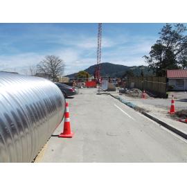 Photograph of the pipe waiting for use at the Utuhina Bridge, 2012