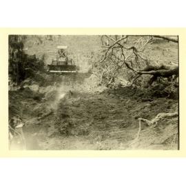 Photograph of Richard Robinson bulldozing a track, ca.1959