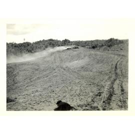 Photograph of Richard Robinson sowing seed, ca.1959