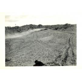 Photograph of Richard Robinson sowing seed, ca.1959