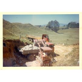 Photograph of Tui Ridge Farm showing track making, ca.1962