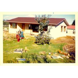 Photograph of Tui Ridge Farm with a new house being built, ca.1972