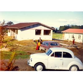 Photograph of Tui Ridge Farm with a new house being built, ca.1972