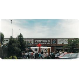 Photograph of the Rotorua Public Library Mobile decorated for Christmas, on the parade past McDonalds