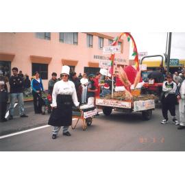 Photograph of library staff member behind the float in the Rotorua Christmas Parade
