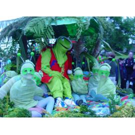 Photograph of the library float for the Rotorua Christmas Parade which features mascot Fletcher the Tuatara and some huhu grubs