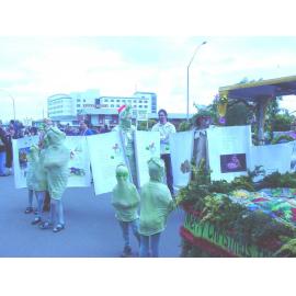Photograph of the library float for the Rotorua Christmas Parade which features mascot Fletcher the Tuatara and some huhu grubs