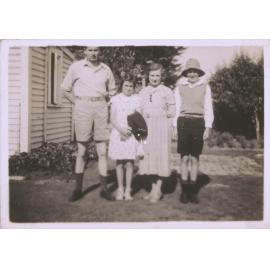 Black and white photograph of a group in a garden