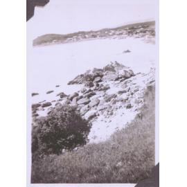 Black and white photograph of a coastal seascape (perhaps Mount Maunganui)