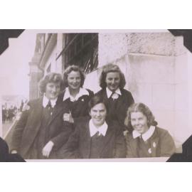 Black and white photograph of six-form students returned from a weekend at Ōhope titled "Next day at school on VI form steps"