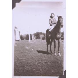 Black and white photograph of "Eunice Jolley" on a horse