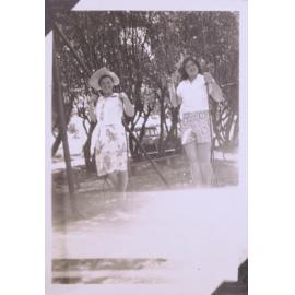 Black and white photograph of "Eunice Jolley" and an unidentified woman on swing
