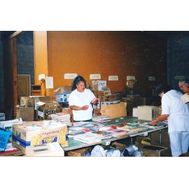 Photograph of Volunteers sorting donations for the Book Fair sportsdrome