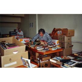 Photograph of Volunteers sorting donations for the Book Fair sportsdrome