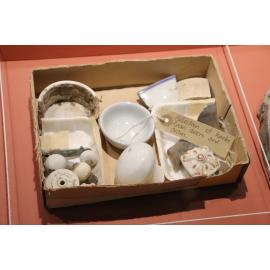 Photograph of a selection of furniture knobs excavated from the Te Wairoa Village