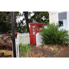 Photograph of the old Whakarewarewa Post Office, showing the phone booth