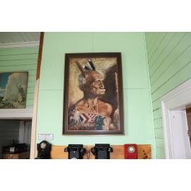 Photograph of the old Whakarewarewa Post Office, showing a portrait of Chief Mita Taupopoki
