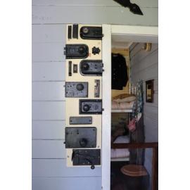 Photograph of the inside of the Rotorua Gaol House 1905-1965, showing examples of old door locks