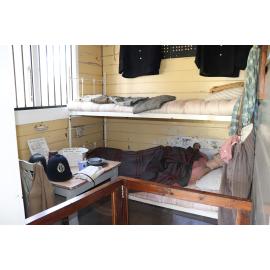 Photograph of the inside of the Rotorua Gaol House 1905-1965, showing the style of prisoners bunks