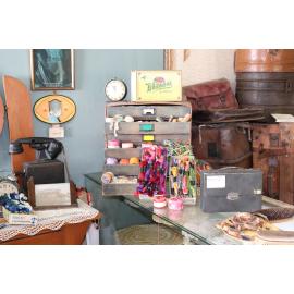 Photograph of some haberdashery, showing leather suitcases