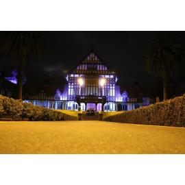 Photograph of the Rotorua Museum lit up for Blue September