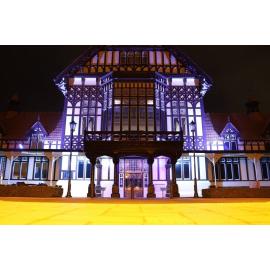 Photograph of the Rotorua Museum lit up for Blue September