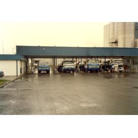 Photograph of trucks unloading, 1968