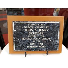 Photograph of the stained-glass windows' plaque at Rotorua Library