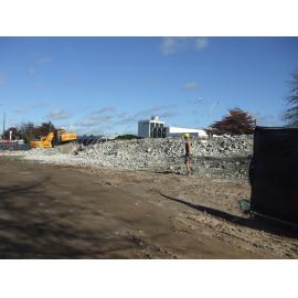 Photograph showing where the workmen are clearing rubble from the Rotorua Police Station