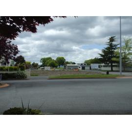 Photograph showing empty ground to the left of the main entrance of QE