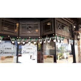 Photograph showing a close up of the stained glass windows of the front of Hennessey's