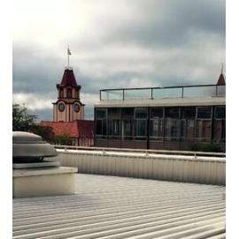 Photograph showing the start of the demolition of Community House with the old Post Office in view