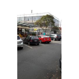 Photograph showing the start of the demolition of Community House from Haupapa Street