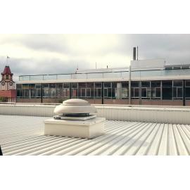 Photograph showing the start of the demolition of Community House top floor