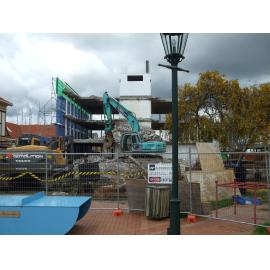 Photograph showing the last bit of the demolition of Community House, the concrete central stairwell