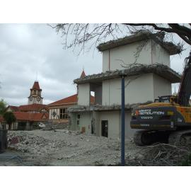 Photograph showing the last bit of the demolition of Community House, the concrete central stairwell