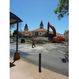 Photograph showing the metal reinforcing rods which once held Community House upright
