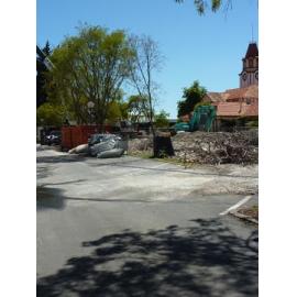 Photograph showing the metal reinforcing rods and removed frames from Community House